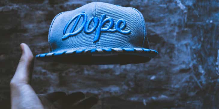 A cap with the word "Dope" embroidered on it.