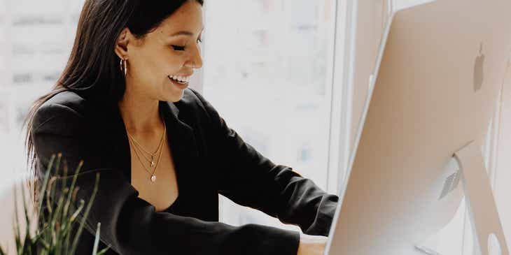 A woman trademarking her business's logo online.