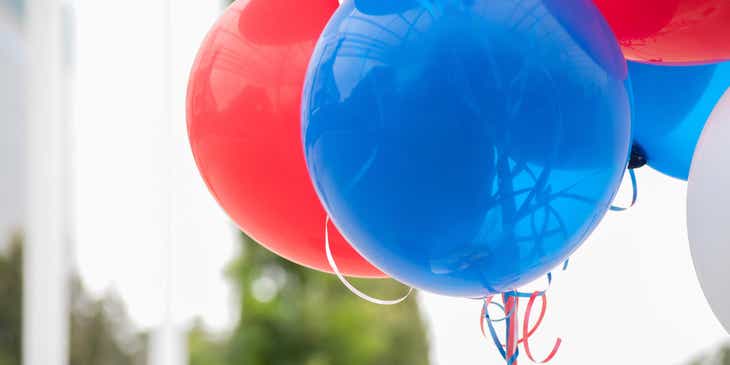 Red, white, and blue balloons.