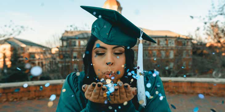 A student celebrating their graduation from an academy business.