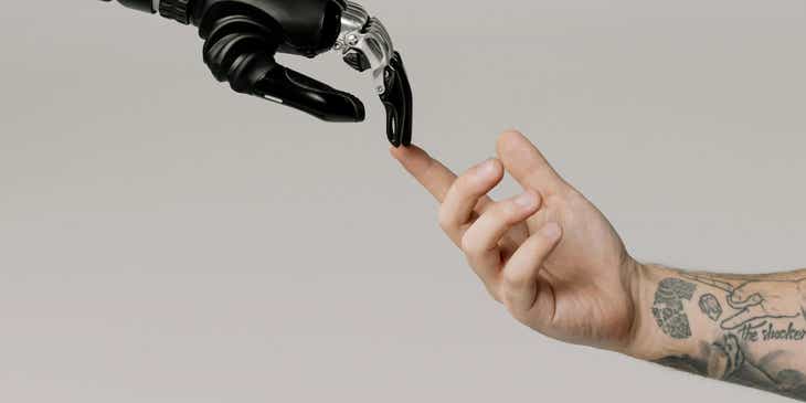 A bionic hand created using artificial intelligence meeting a human hand.