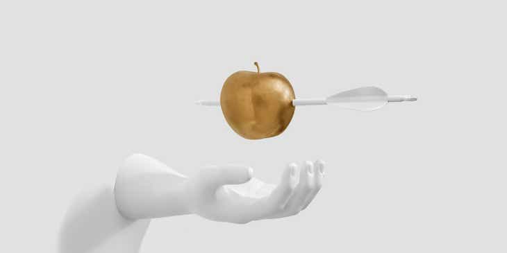 Ein fesselndes Bild von einer aus einer Mauer ragenden Hand, über der ein von einem Pfeil durchbohrter, goldener Apfel schwebt.