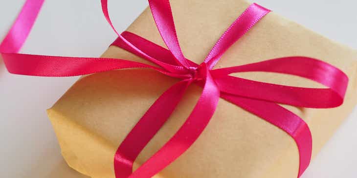 A box wrapped in brown and pink gift wrapping.