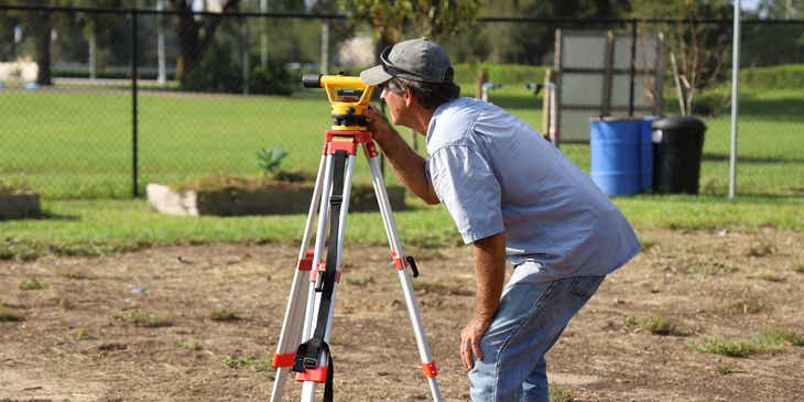 A man conducting a land survey.