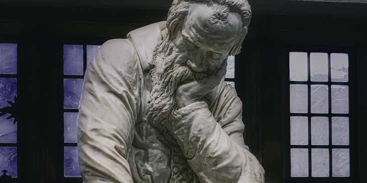 A statue of Galileo in a meaningful pose.