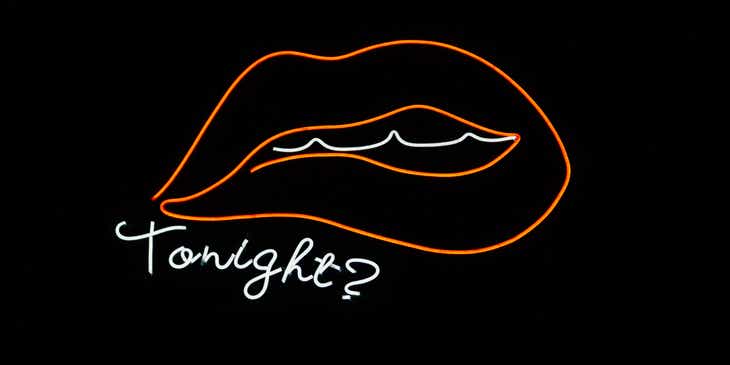 Um desenho minimalista de lábios sensuais em um fundo escuro.