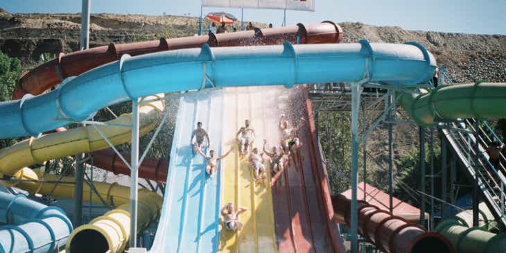 Children on the slide of a water park.